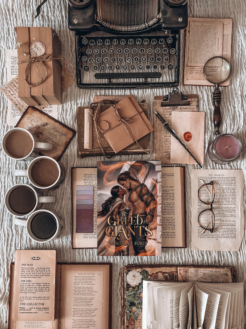 Vintage typewriter, books, and coffee cups on a textured surface